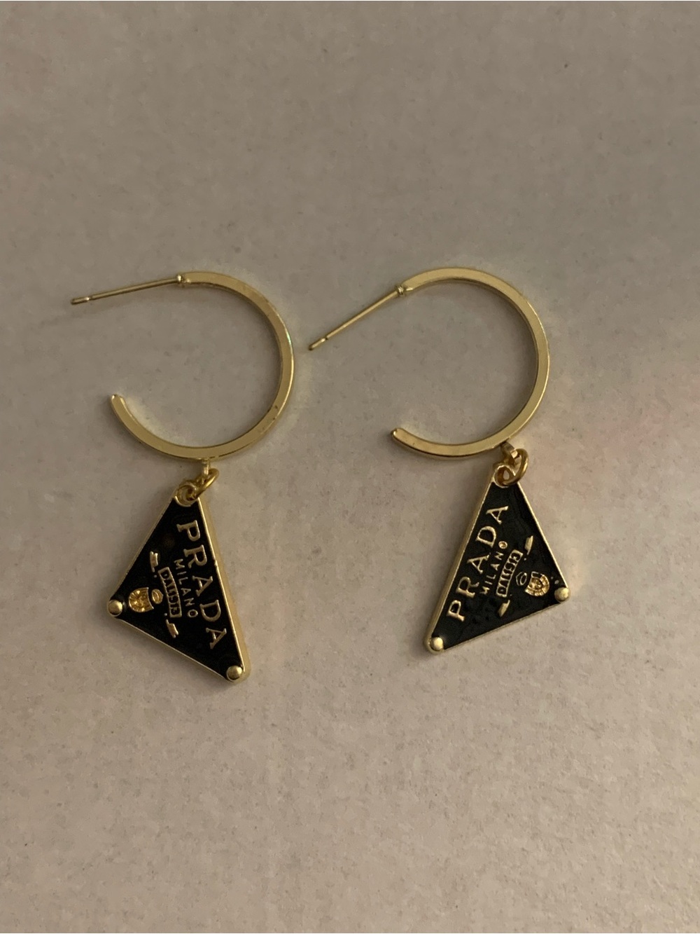 Brand new Gold-Tone Black Enamel Triangle Logo Hoop Earrings